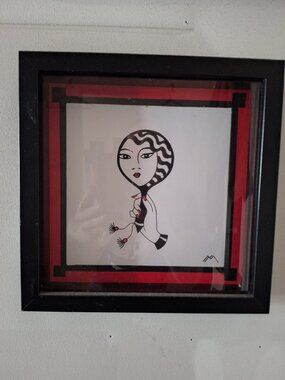 Shadowbox framed illustration of woman with fan